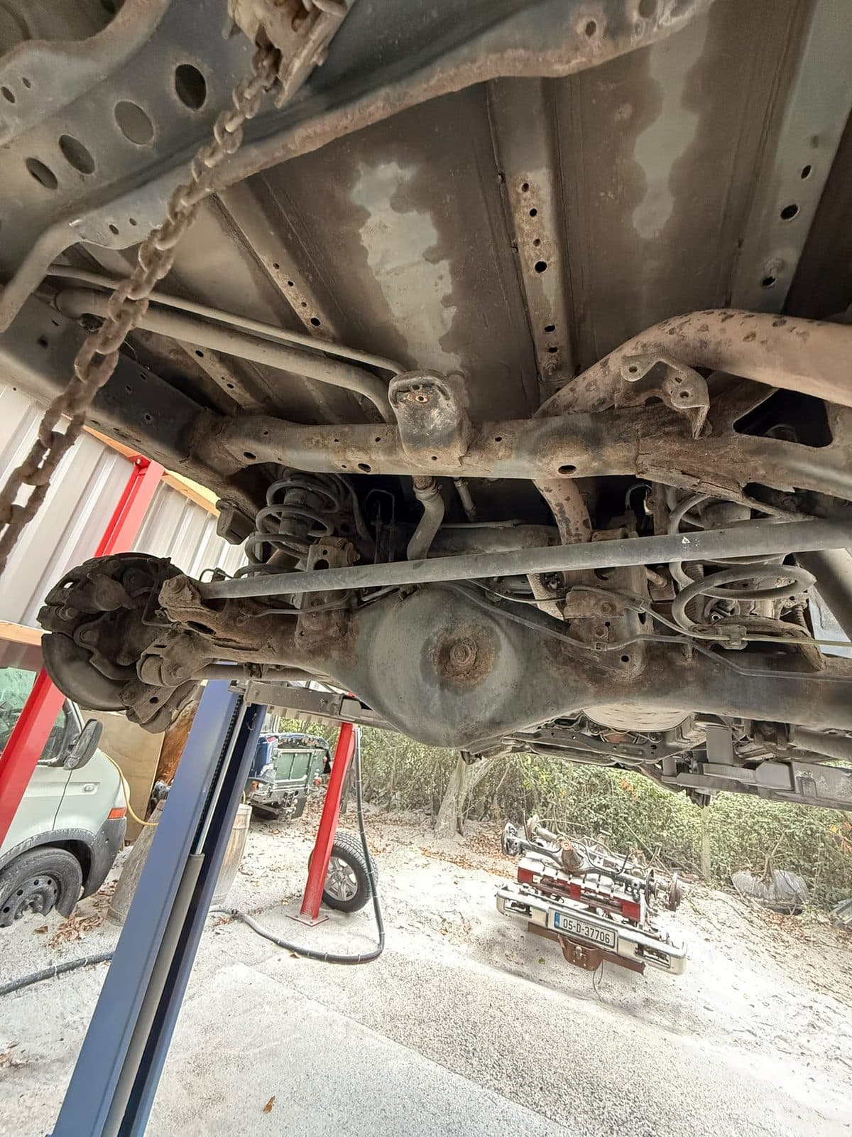4×4 rear underside before restoration, with corrosion and road grime